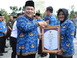 Bupati Siak Terima Penghargaan UHC di Tengah Ujian Keluarga